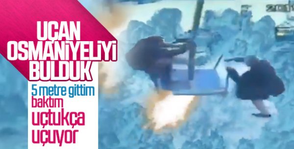 Şemsiyeyle uçan adamlar poz verdi